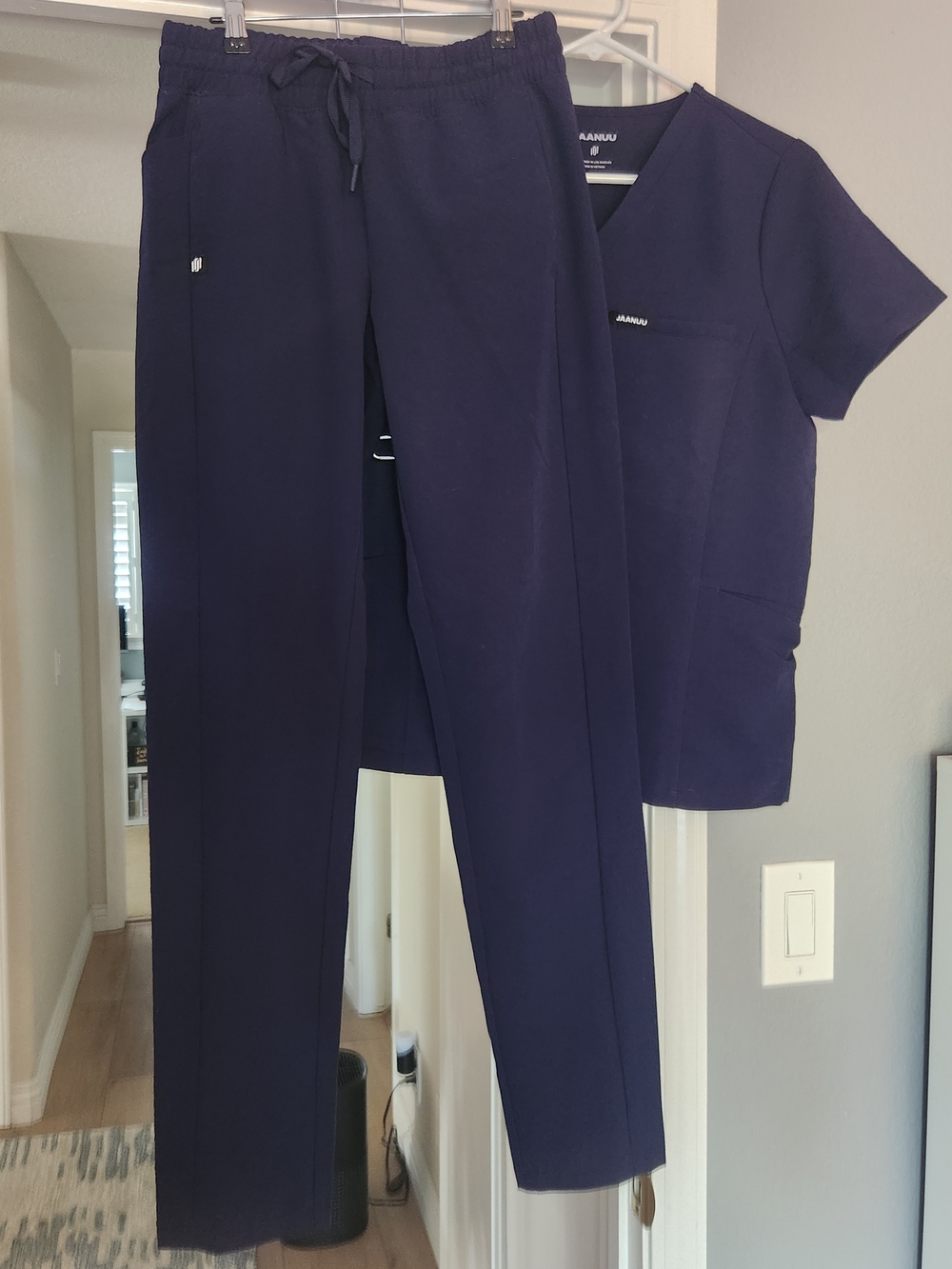 JAANUU Women's Scrub Set in Navy. XS scrub top, XS/Tall scrub pant